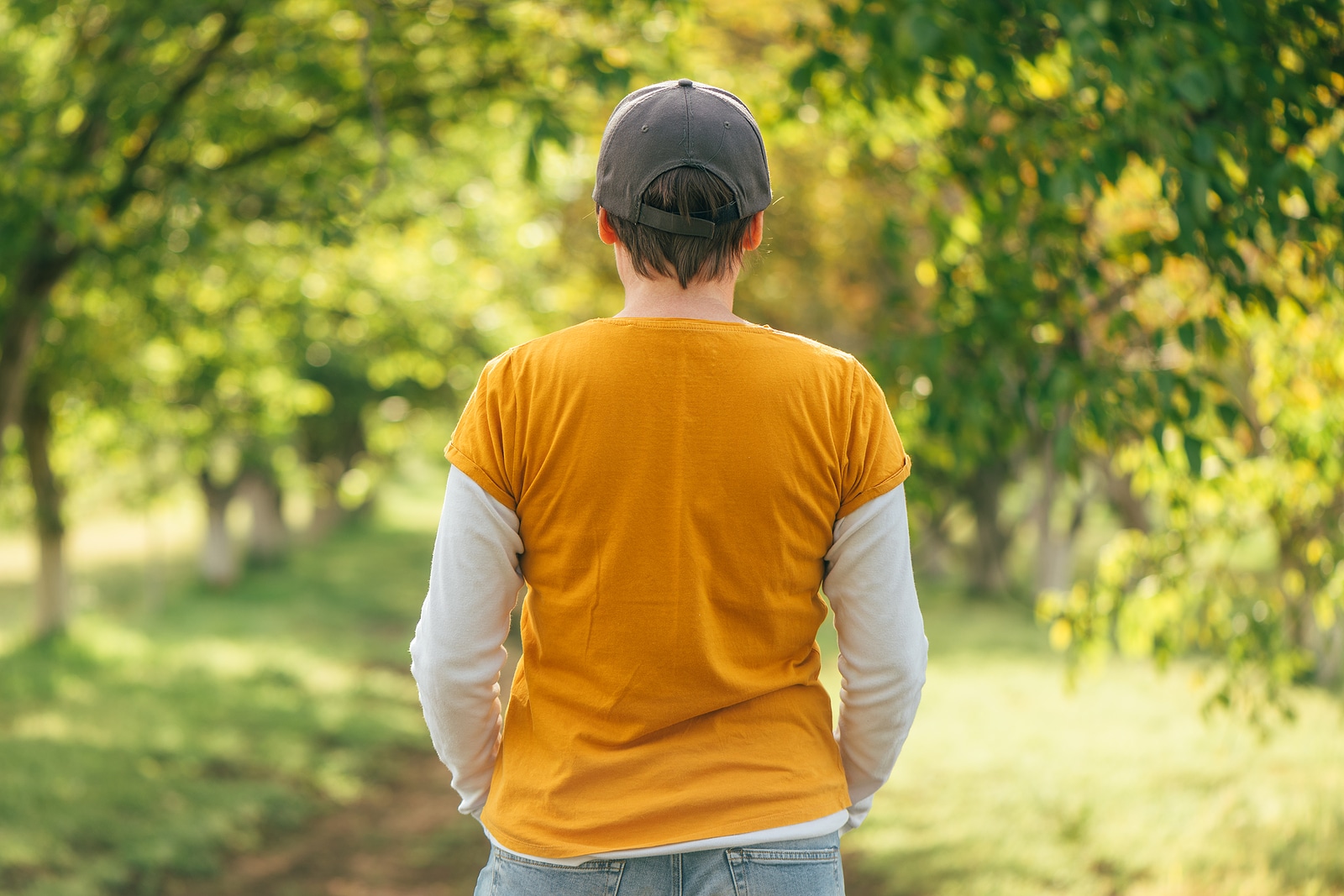 Woman wearing orange shirt.