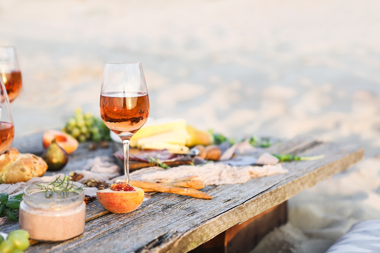 Rose wine at a beach picnic.