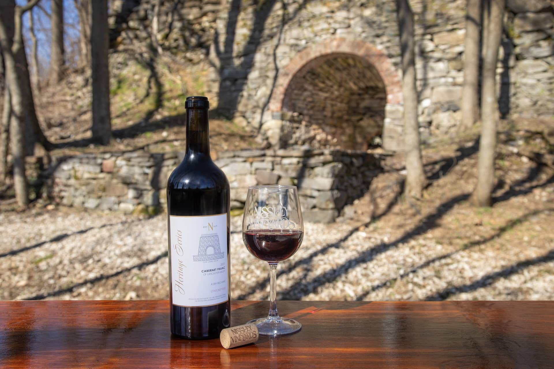 A bottle and glass of the Heritage Series Cabernet Franc at Nissley Vineyards.