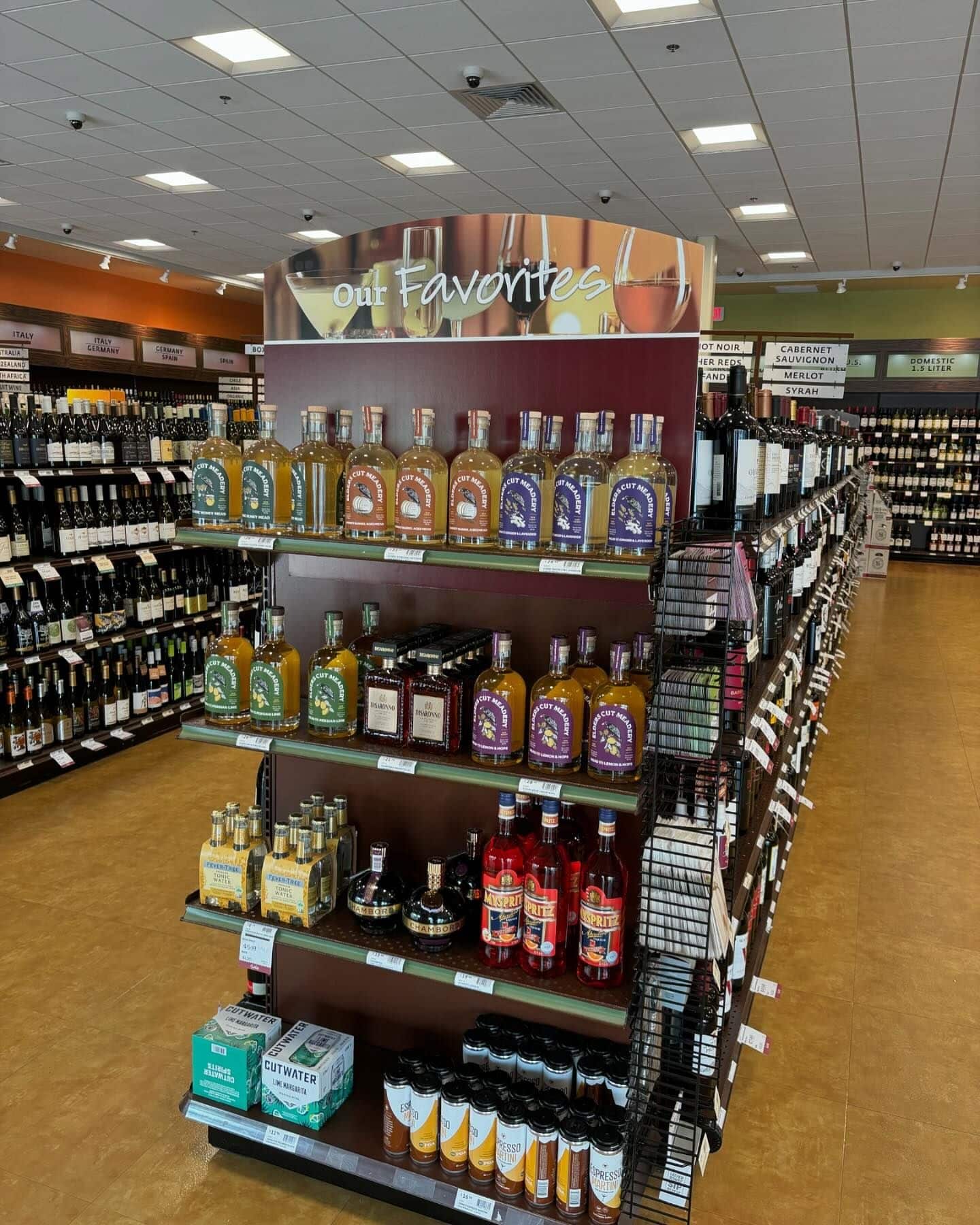 Mead on the shelves of a fine wine and spirits shop.