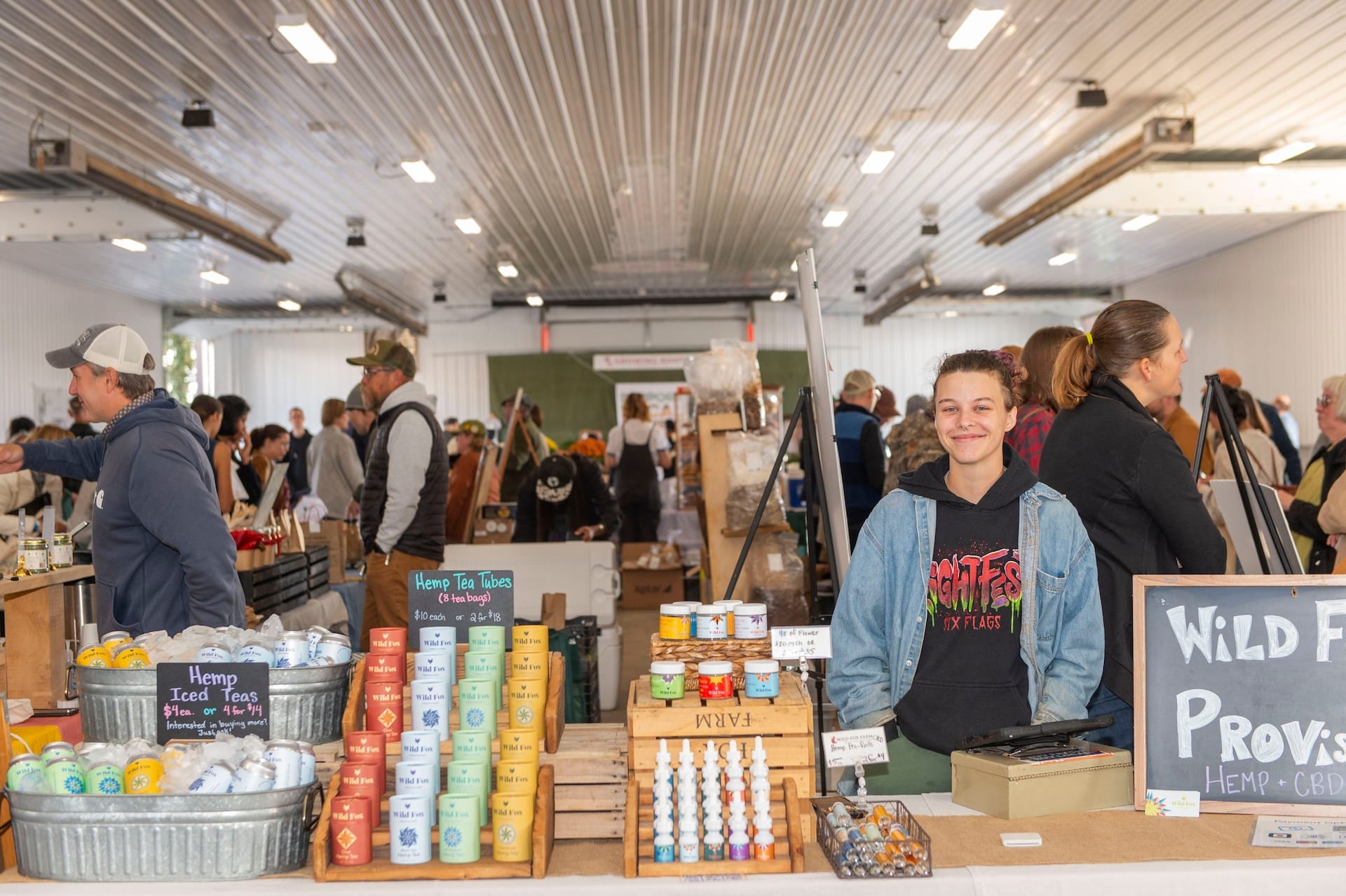 A smiling hemp product vendor at GFF.