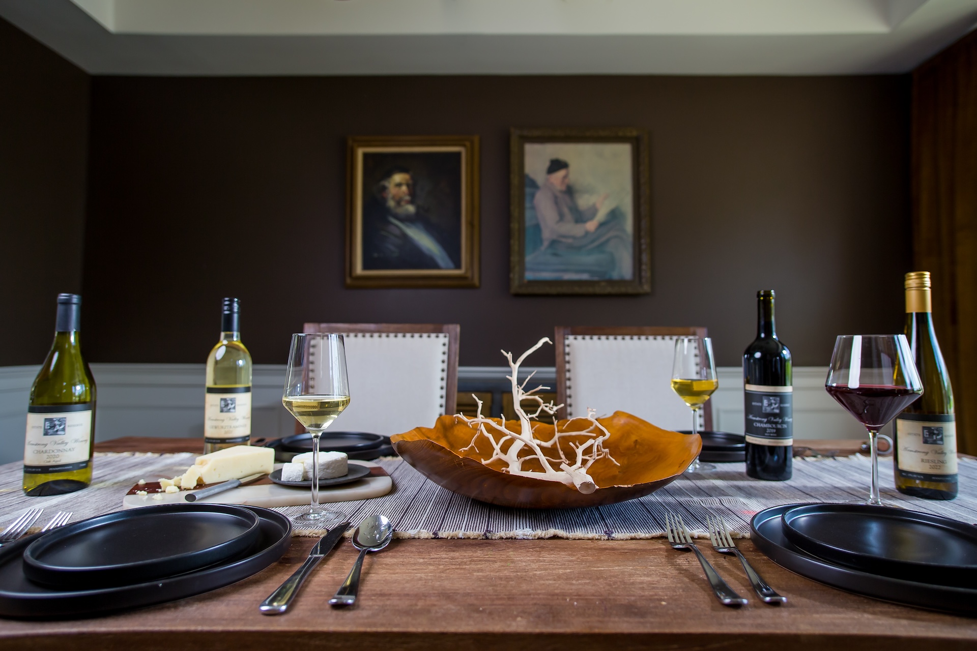 A moody table set with Armstrong wines.