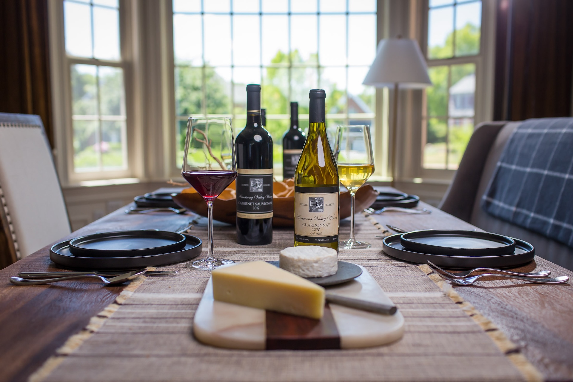 A wine and cheese pairing table setting at Armstrong.