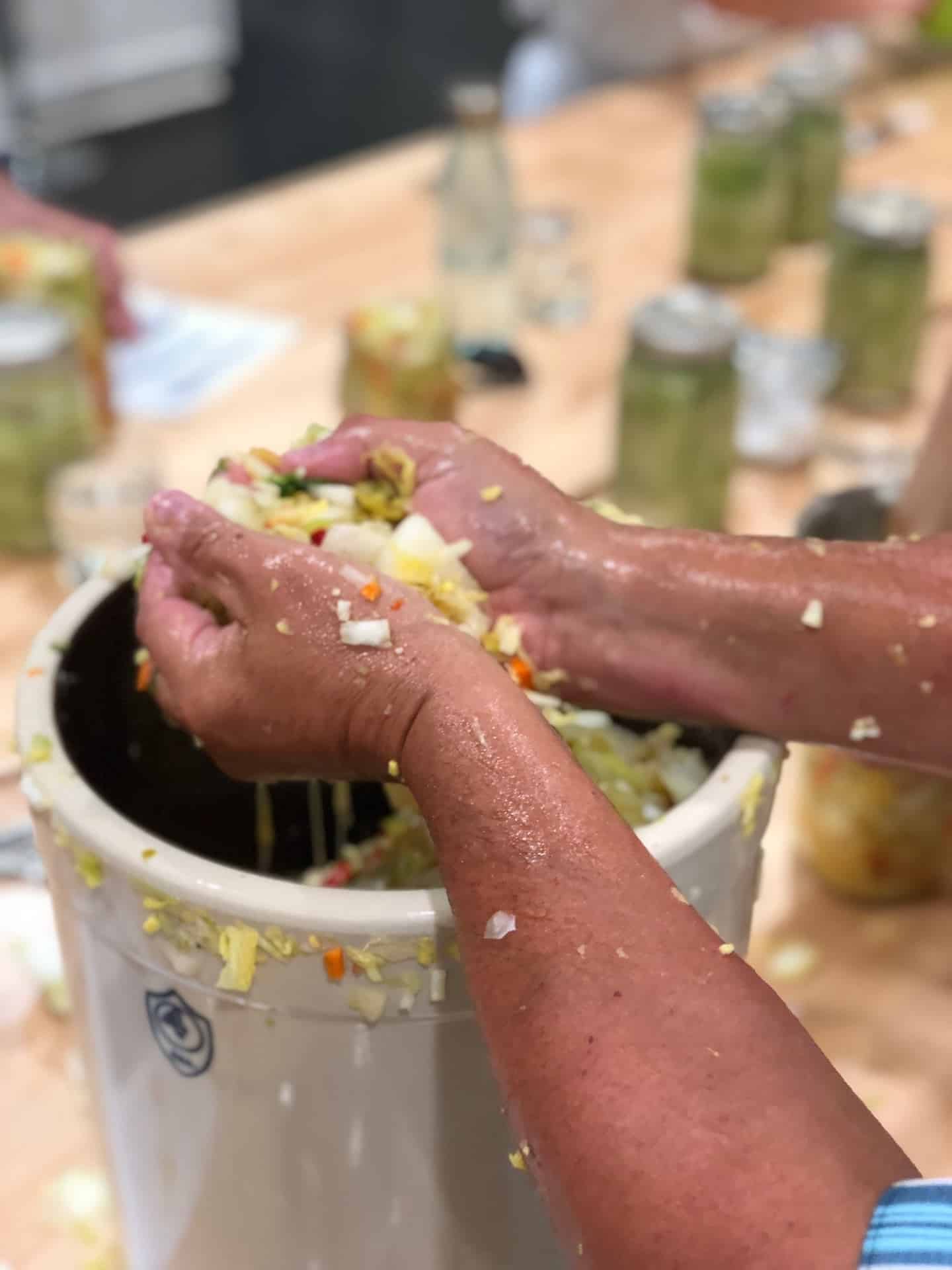 Hands in a fermenting food.