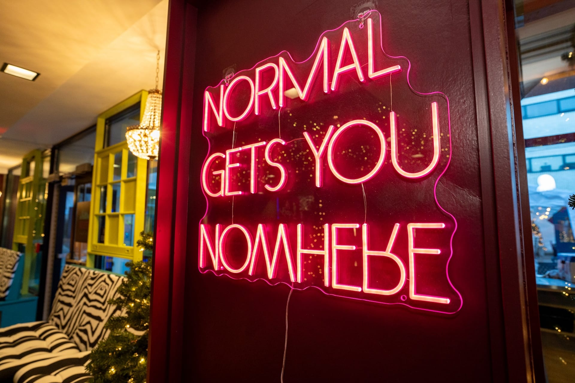 "Normal Gets You Nowhere" sign at Misfits pop-up bar.