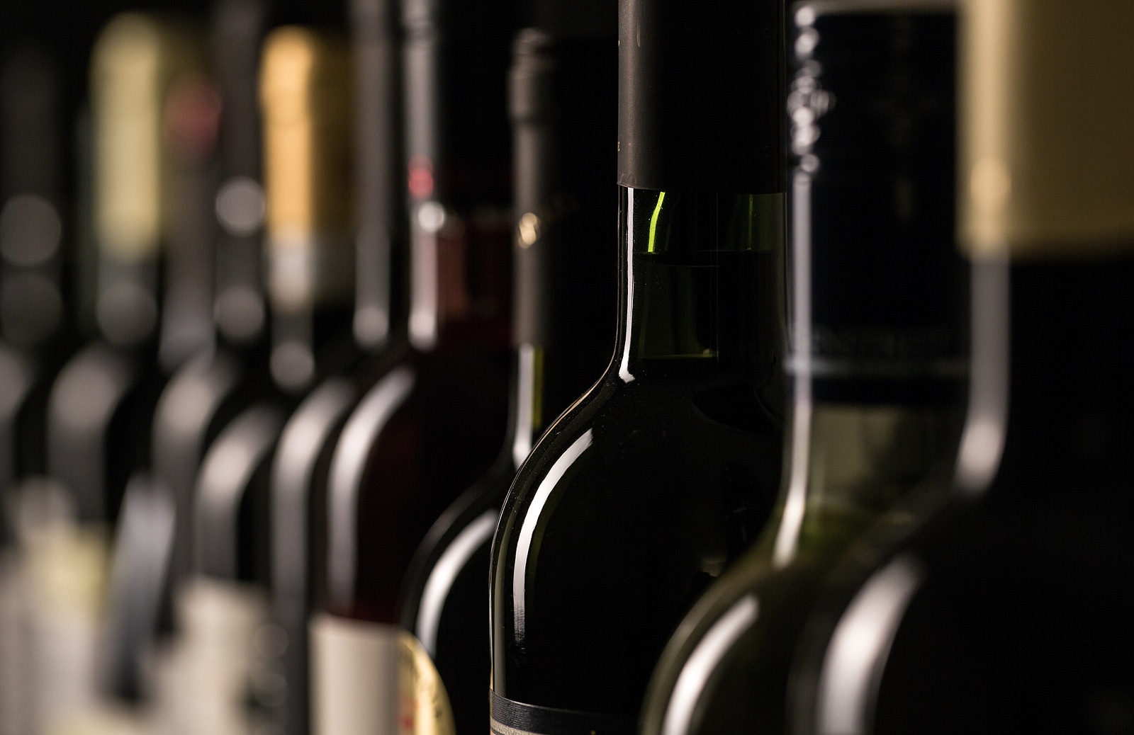 Rows of vintage wine bottles. 