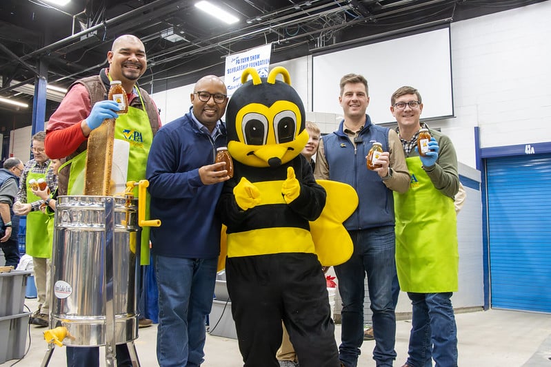 Representatives Fleming, Scott, Cabell, and Ecker pose with the completed jars of honey they extracted from a hive themselves Thursday during the Celebrity Honey Extraction Contest.