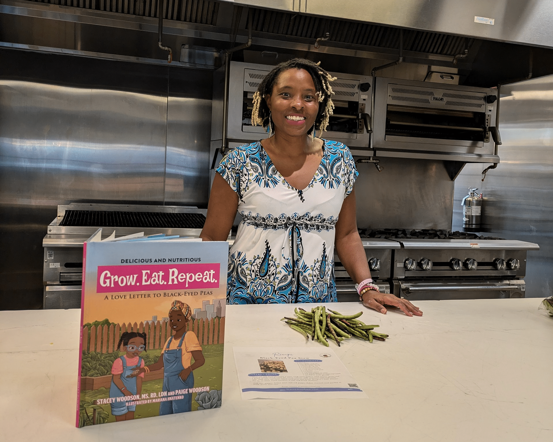 Stacey Woodson with her book before a cooking workshop.